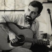 Billy Simons, Jr, with his guitar