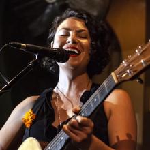 Heather Aubrey Lloyd playing guitar