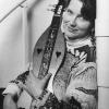 photo of sally rogers holding her dulcimer