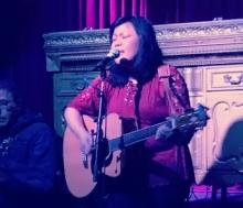 Frances Ancheta performing with her guitar