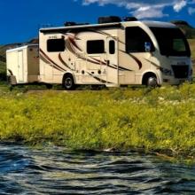 Michael Lille's RV and trailer by a river